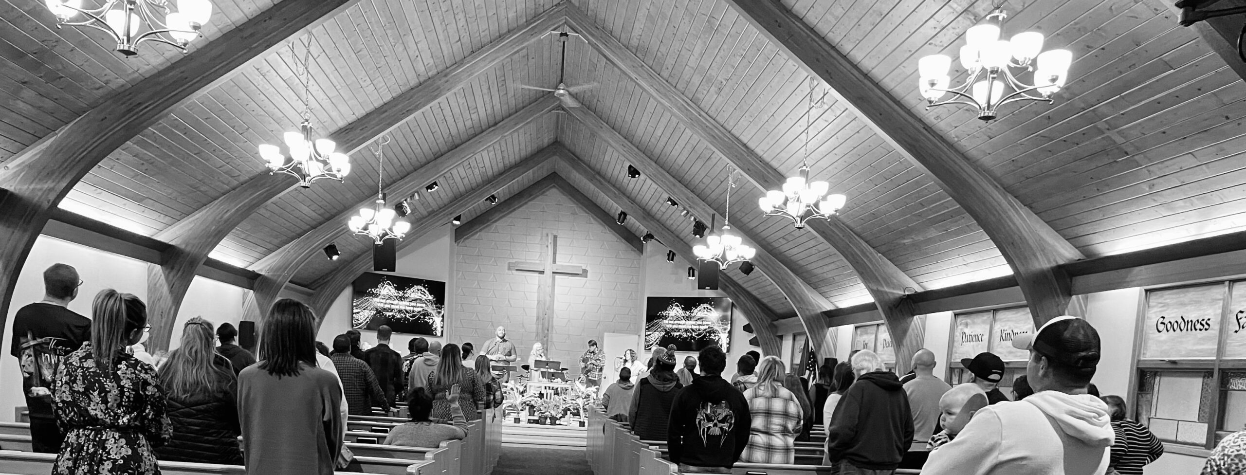 Riverview Church sanctuary in dramatic black and white showing the worship space during service