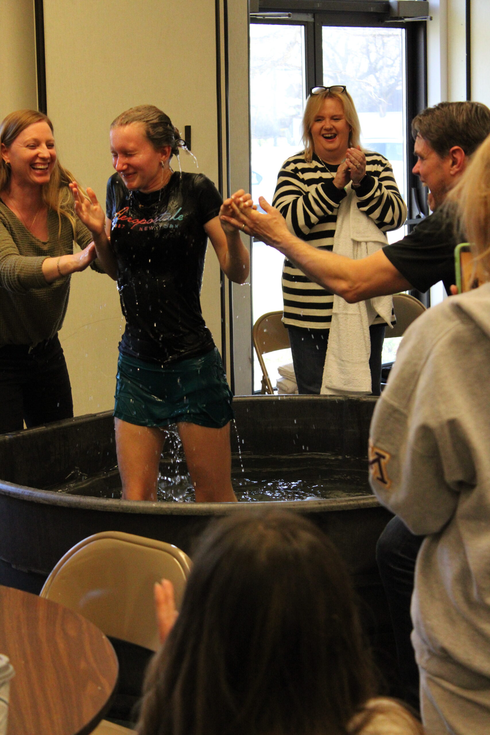 Baptism celebration moment with water splash at Riverview Church