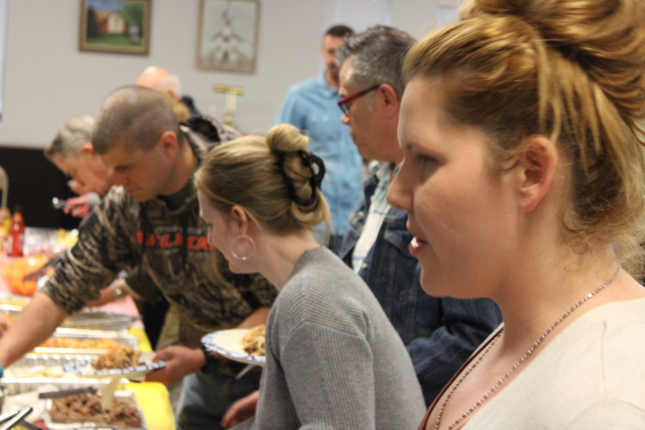 Riverview Church congregation enjoying fellowship together at a community potluck gathering